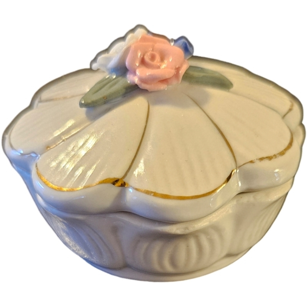 vintage porcelain trinket box featuring a floral design